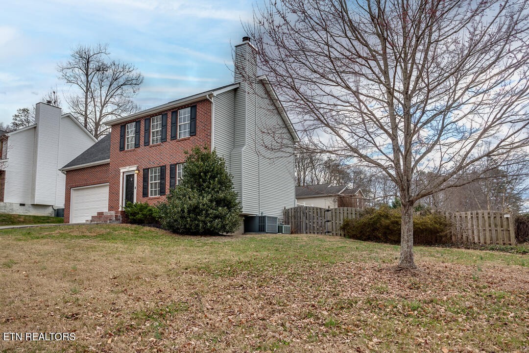 1296 Emerald Forest Lane Powell, TN 37849 - Photo 3 of 43 a view of a house with a yard