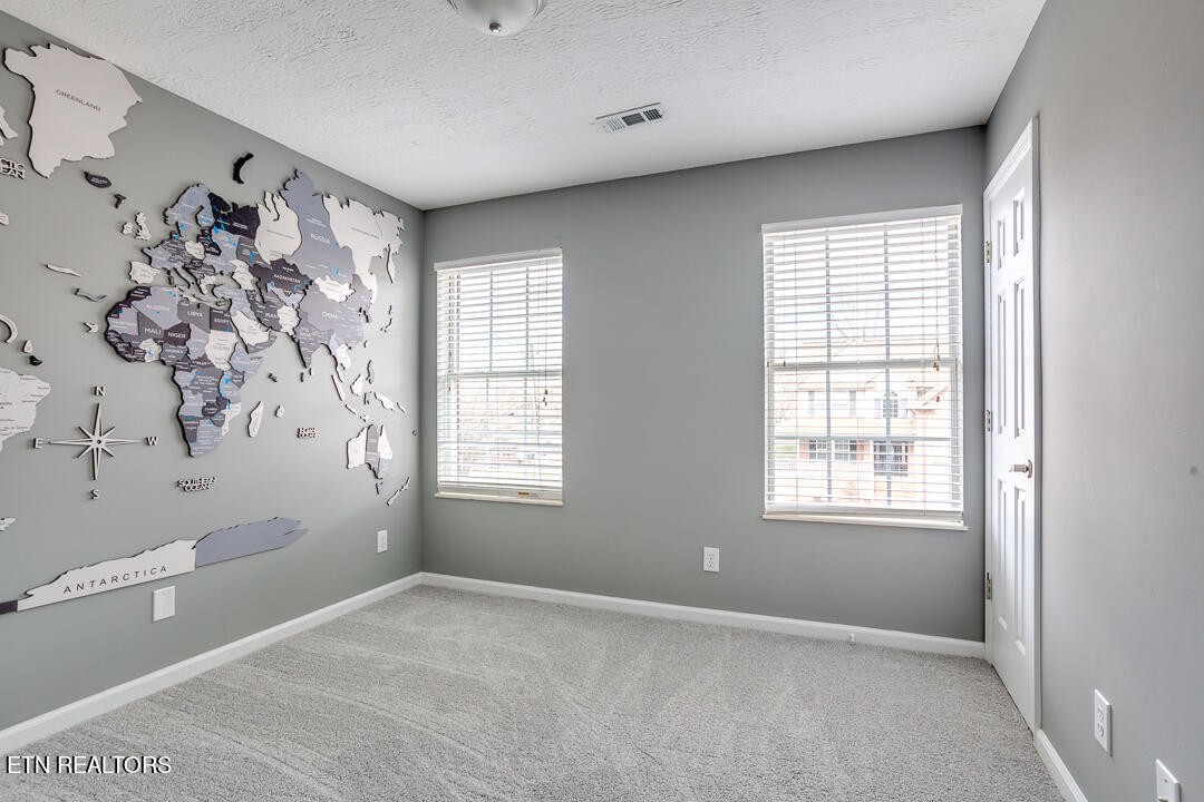 1296 Emerald Forest Lane Powell, TN 37849 - Photo 33 of 43 a view of a big room with windows and chandelier fan