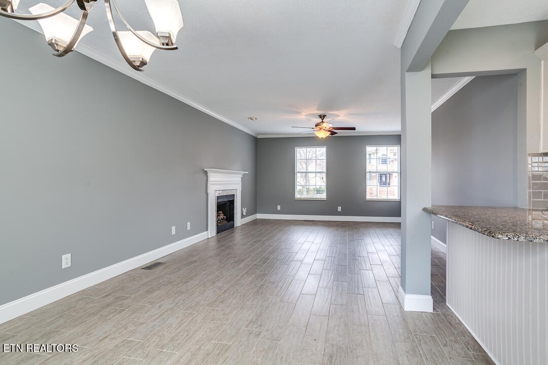 1296 Emerald Forest Lane Powell, TN 37849 - Photo 10 of 43 wooden floor in an empty room with a window