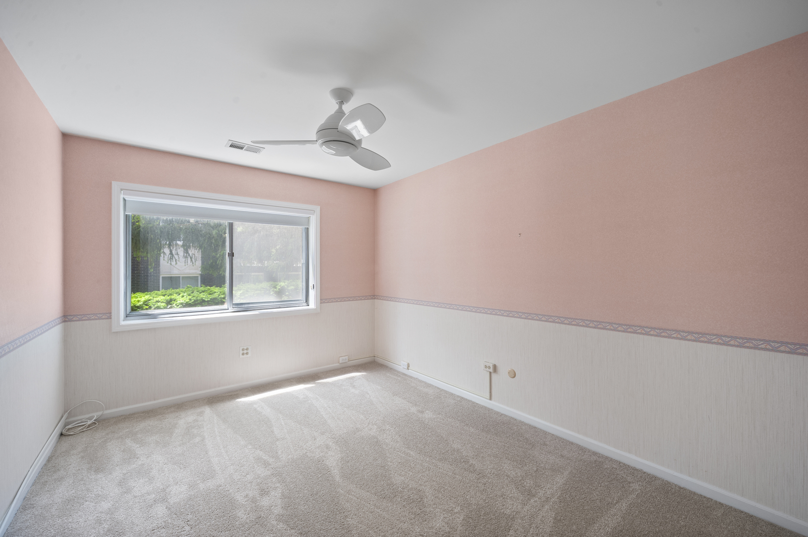 4949 Golf Road, Unit 101 Skokie, IL 60077 - Photo 14 of 22 a view of an empty room with a window