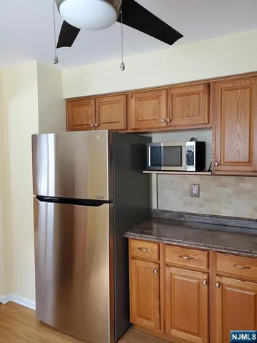 a white refrigerator freezer sitting in a kitchen