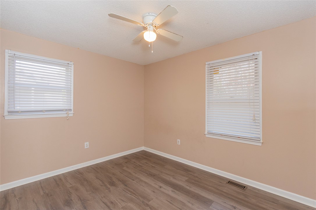 1118 Gilreath Road Anderson, SC 29621 - Photo 13 of 18 This bright and airy room offers a comfortable and inviting atmosphere for relaxation and rest.
