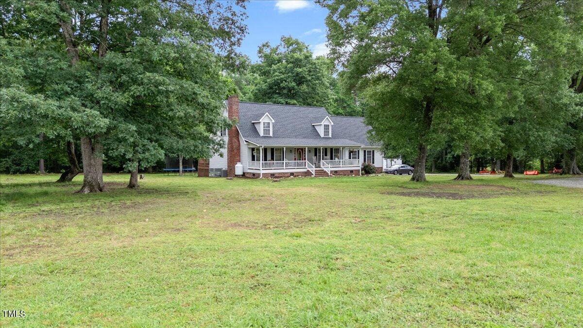1401 Berea Road Rougemont, NC 27572 - Photo 1 of 65 a front view of a house with garden