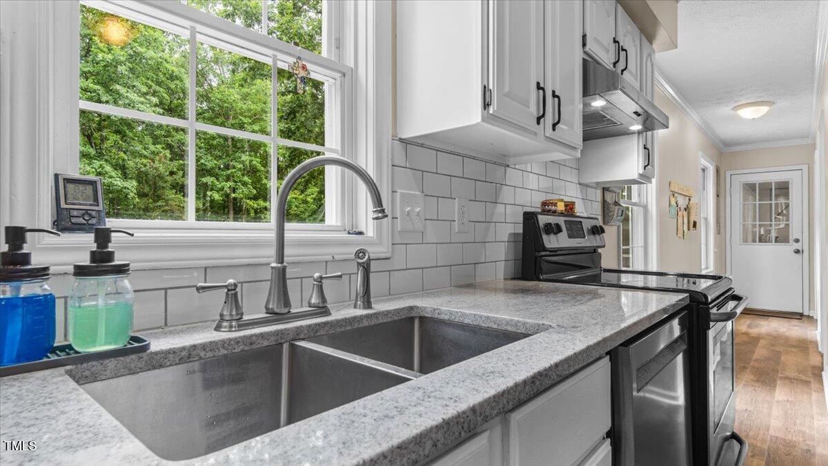 1401 Berea Road Rougemont, NC 27572 - Photo 17 of 65 a kitchen with a sink and a large window