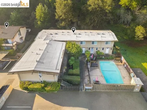 a aerial view of a house with a yard