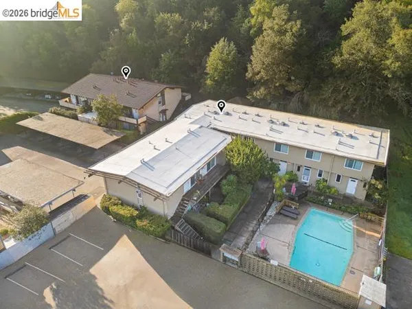 an aerial view of a house with outdoor space
