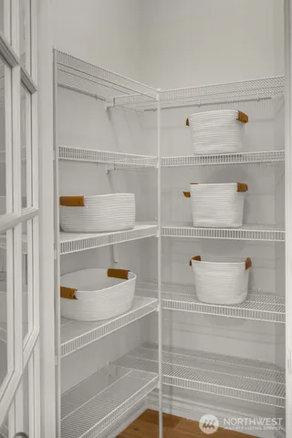 a balcony with furniture and wooden floor