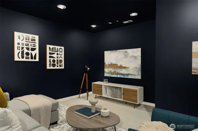 a living room with furniture and a potted plant