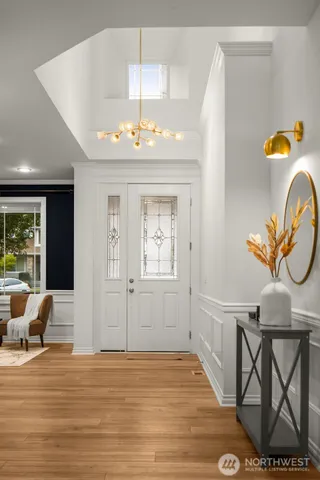 a view of a livingroom with furniture and wooden floor