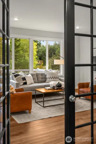 a living room with furniture and a large window