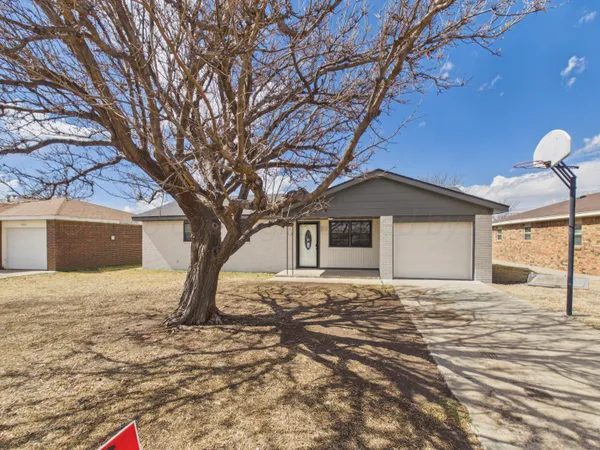 a house with yard in front of it