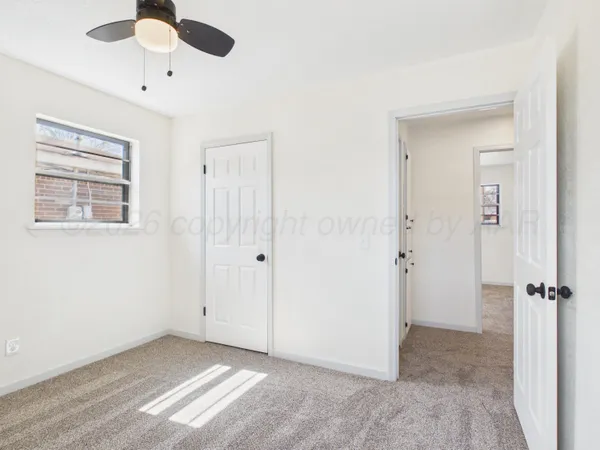 a view of an empty room with a window