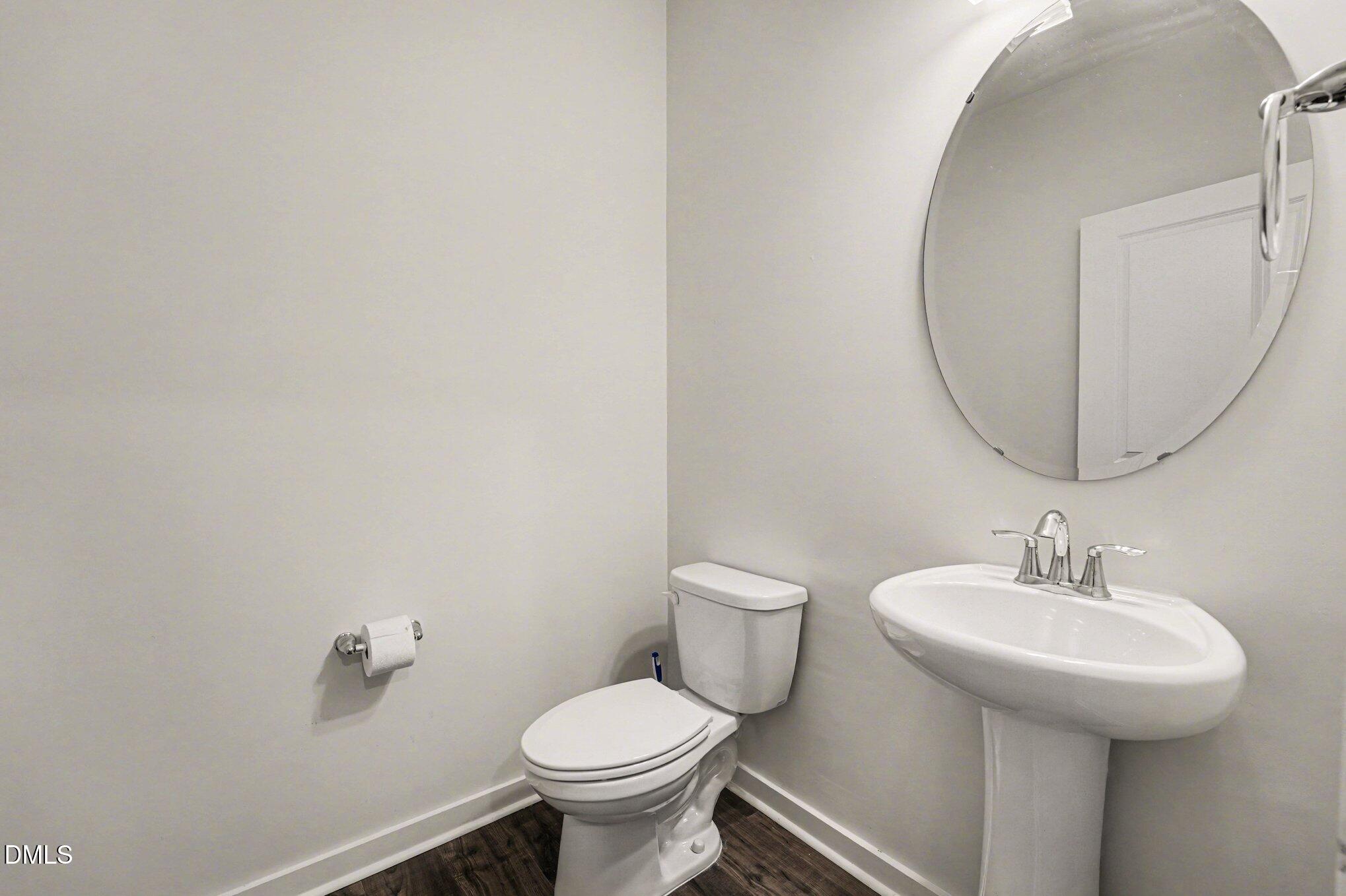 51 East Dentaires Way Willow Spring, NC 27592 - Photo 20 of 39 a bathroom with a sink and mirror