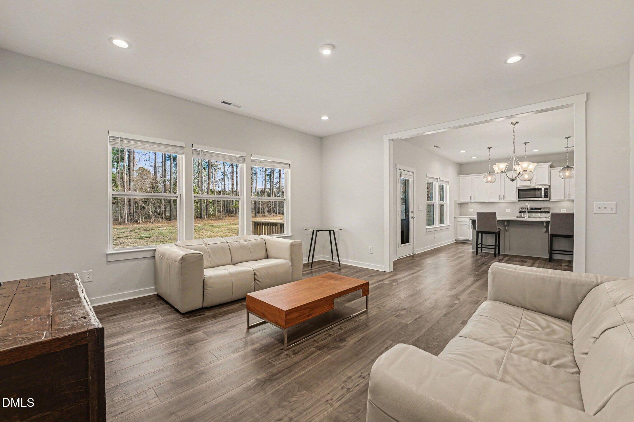 51 East Dentaires Way Willow Spring, NC 27592 - Photo 21 of 39 a living room with furniture and a large window