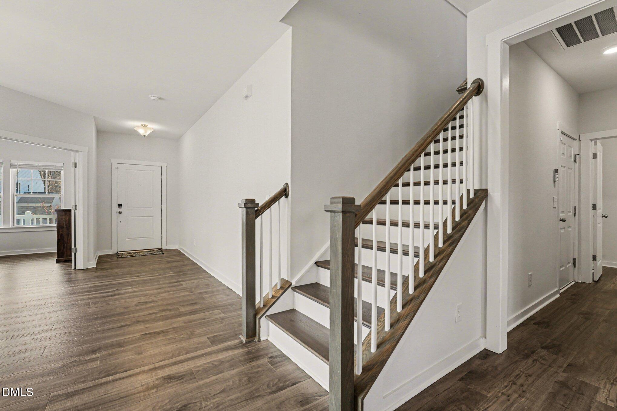 51 East Dentaires Way Willow Spring, NC 27592 - Photo 22 of 39 a view of entryway with wooden floor and stairs