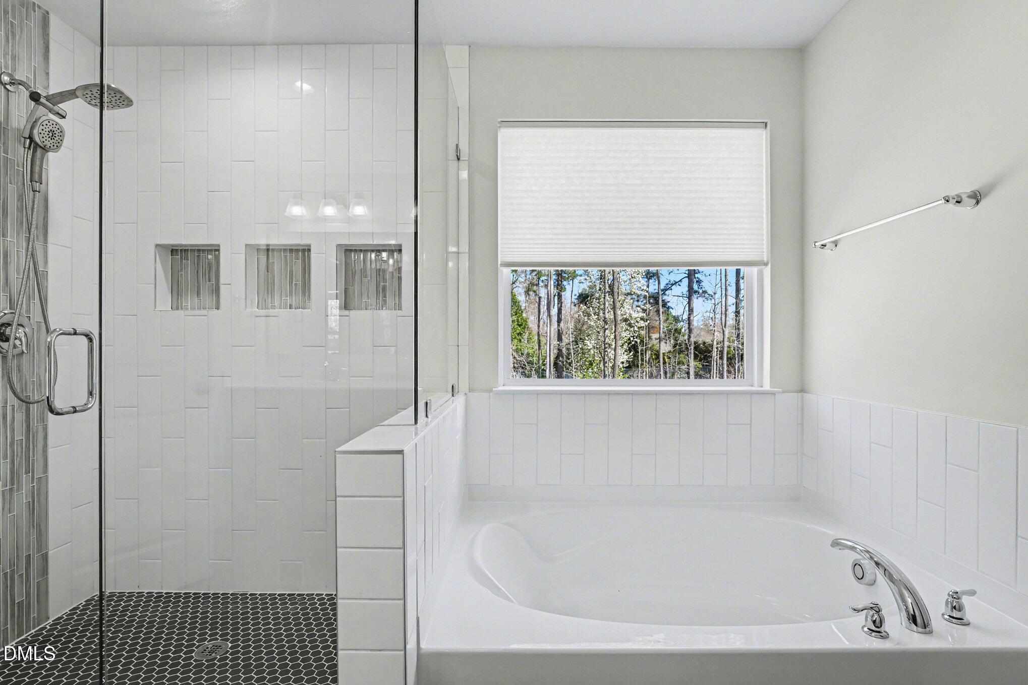 51 East Dentaires Way Willow Spring, NC 27592 - Photo 27 of 39 a bathroom with a bathtub and window