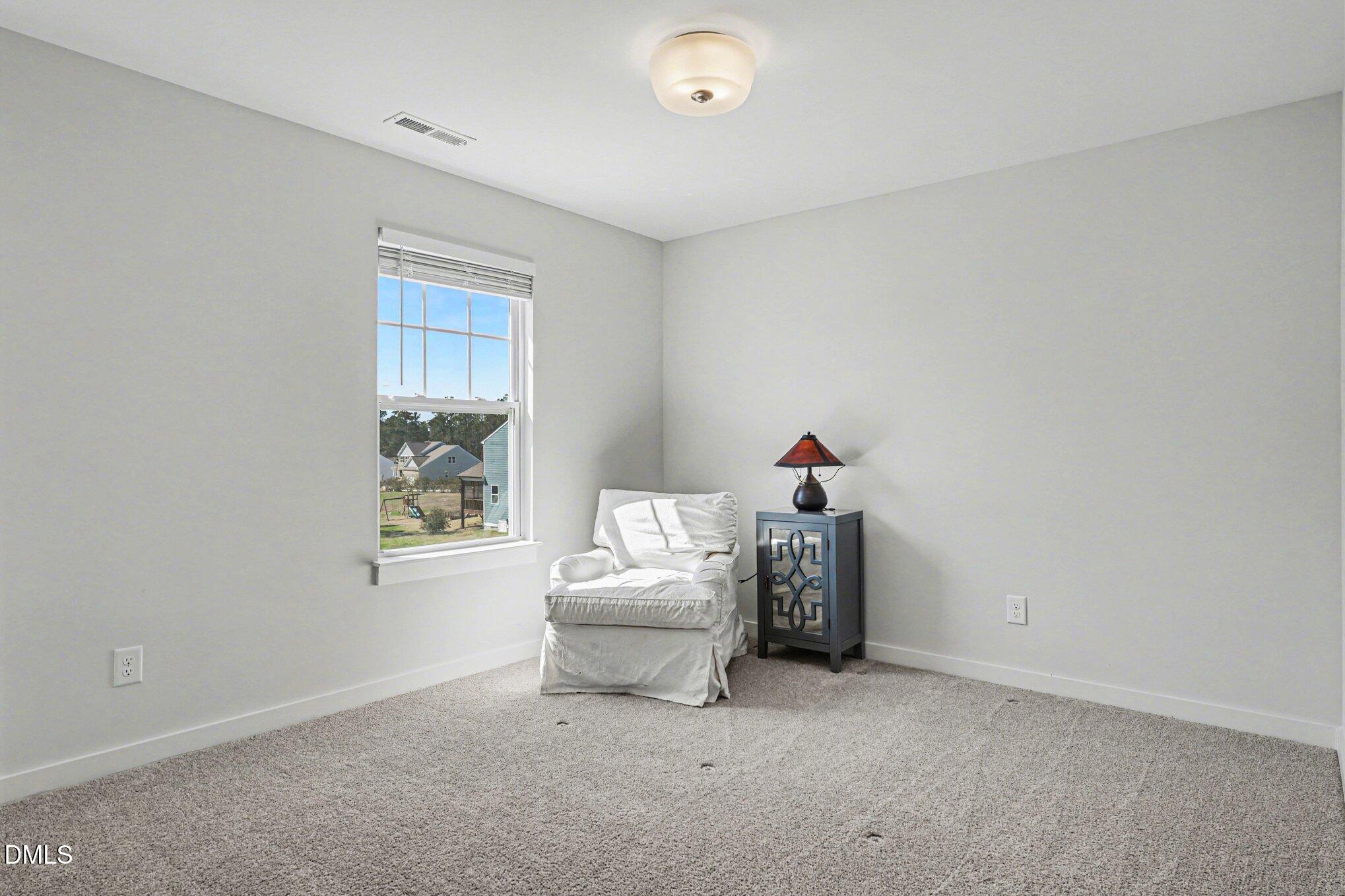 51 East Dentaires Way Willow Spring, NC 27592 - Photo 29 of 39 a living room with furniture and a window