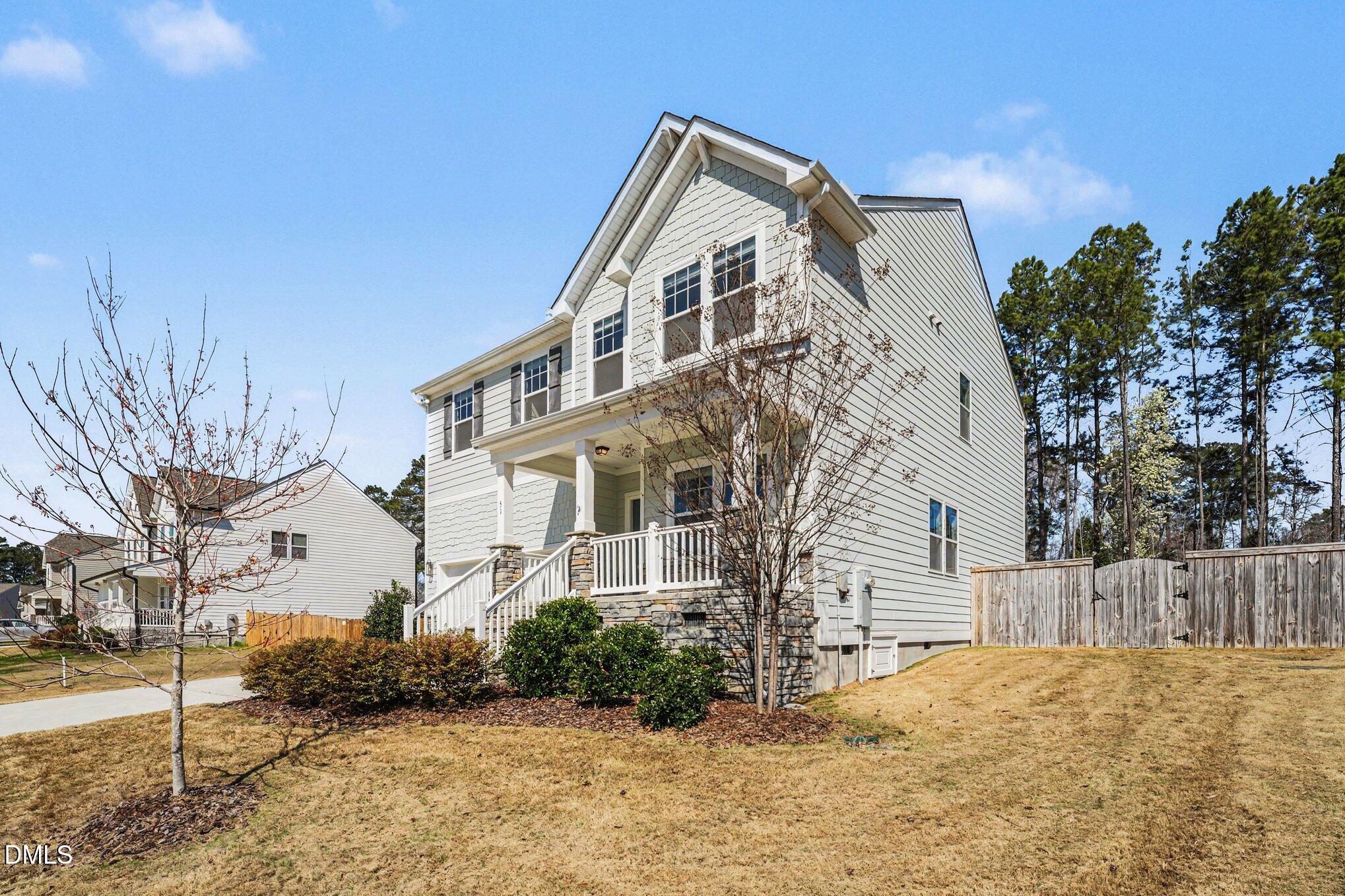 51 East Dentaires Way Willow Spring, NC 27592 - Photo 3 of 39 a front view of a house with a yard