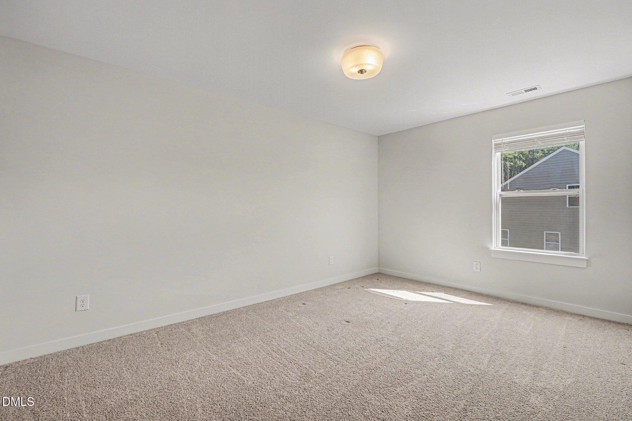 51 East Dentaires Way Willow Spring, NC 27592 - Photo 31 of 39 an empty room with windows