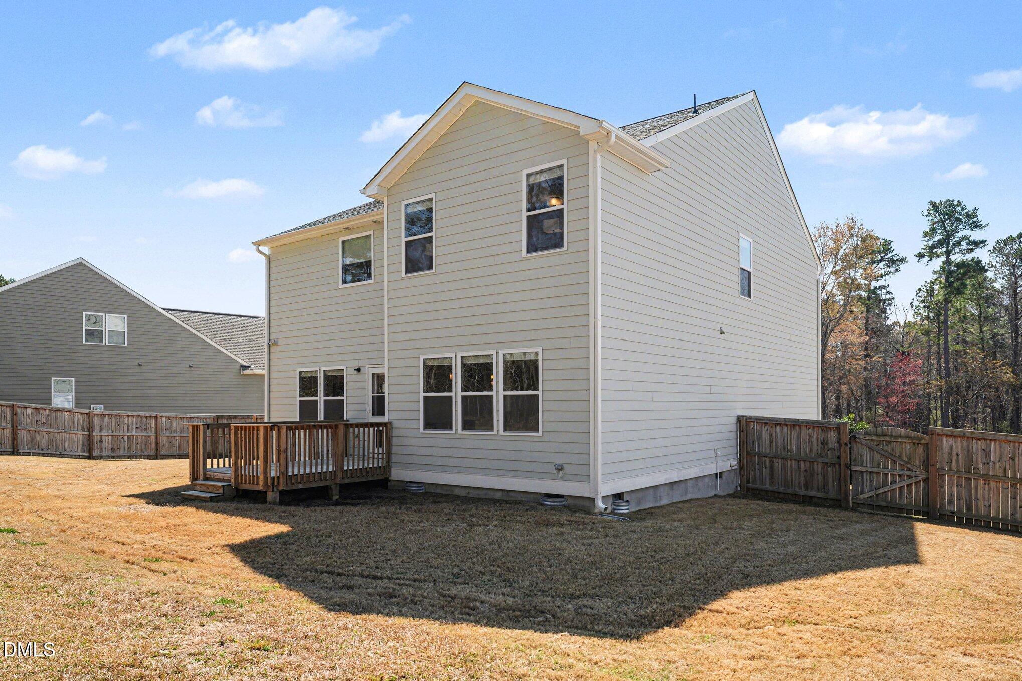 51 East Dentaires Way Willow Spring, NC 27592 - Photo 36 of 39 a view of a house with a yard
