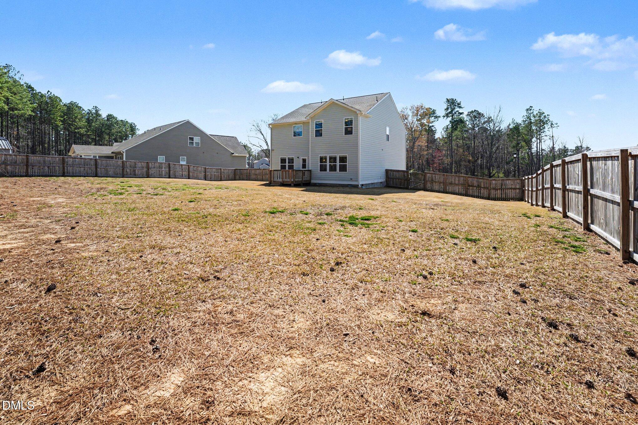 51 East Dentaires Way Willow Spring, NC 27592 - Photo 37 of 39 a view of a house with a yard