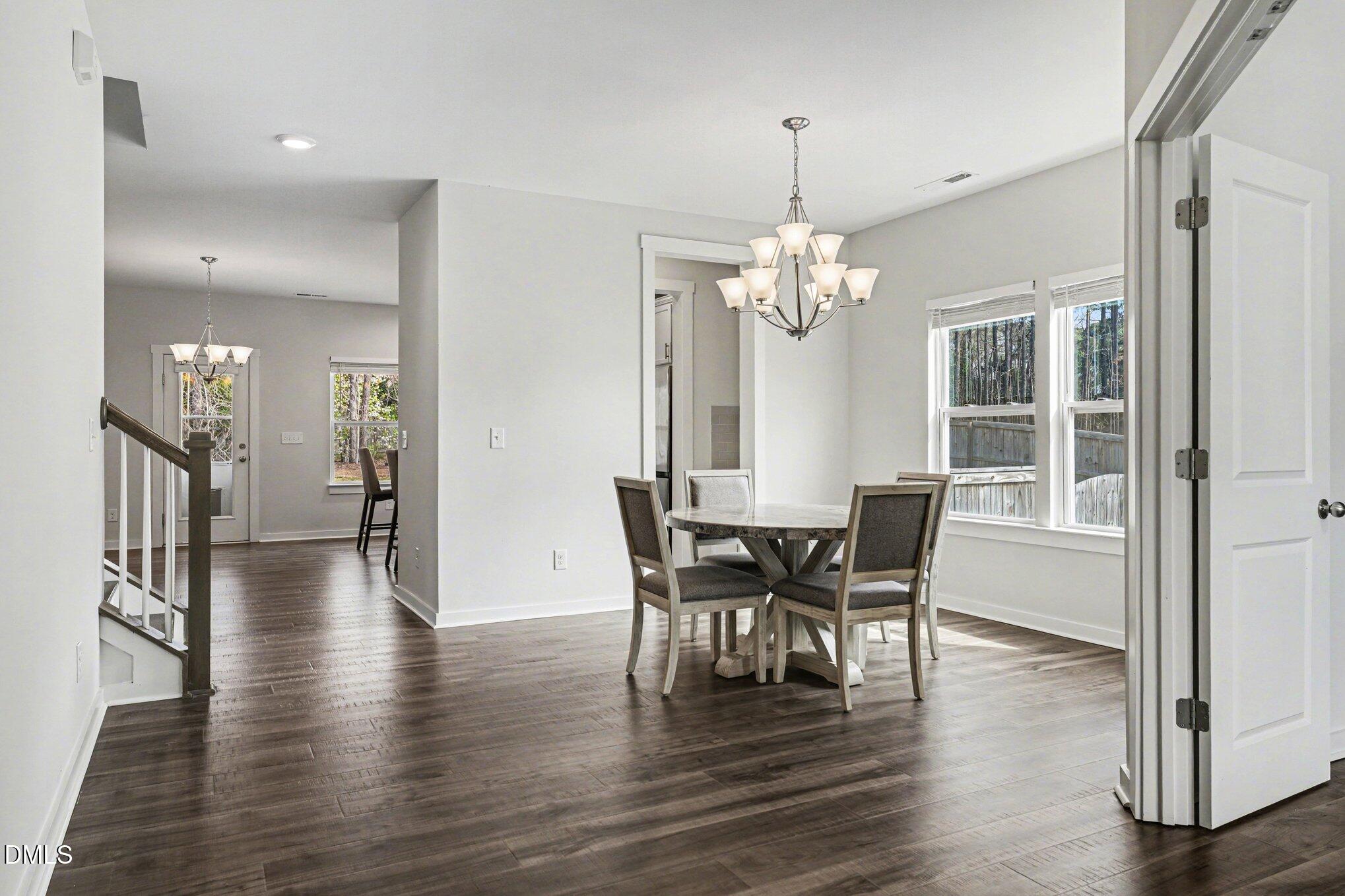 51 East Dentaires Way Willow Spring, NC 27592 - Photo 8 of 39 a view of a dining room with furniture window and wooden floor