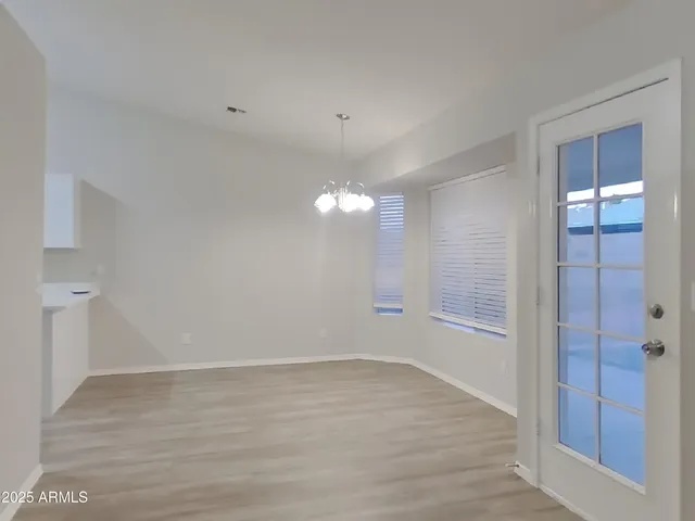 a view of a hallway with stairs