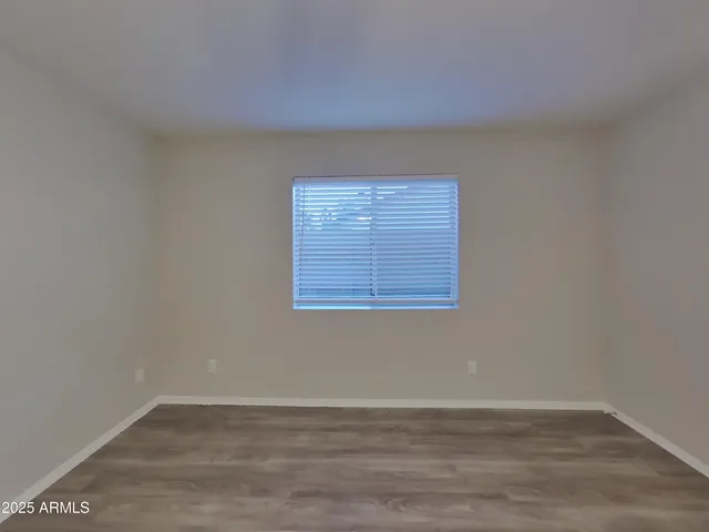 a kitchen with a refrigerator sink and cabinets