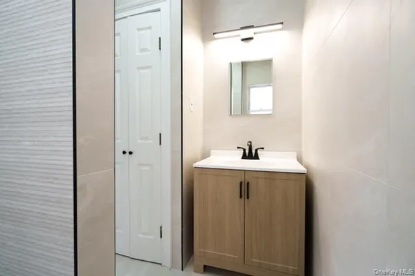 a bathroom with a sink and mirror