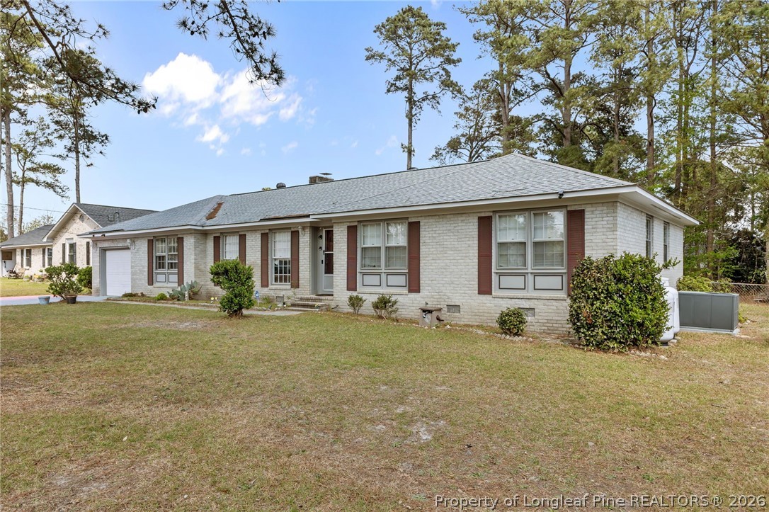 908 Ruton Court Fayetteville, NC 28303 - Photo 2 of 29 a front view of a house with a garden and porch