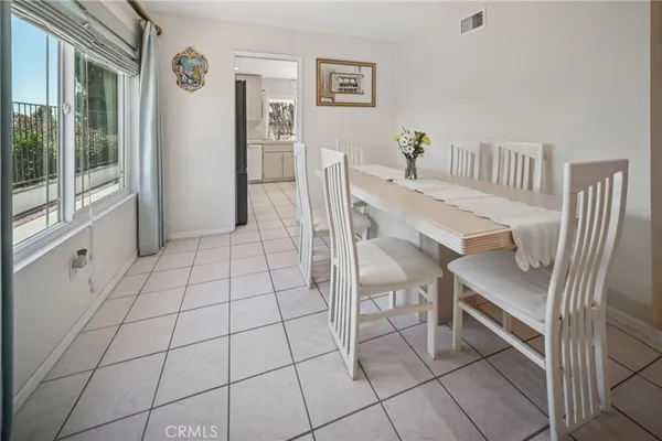 a kitchen with stainless steel appliances a refrigerator and a stove top oven