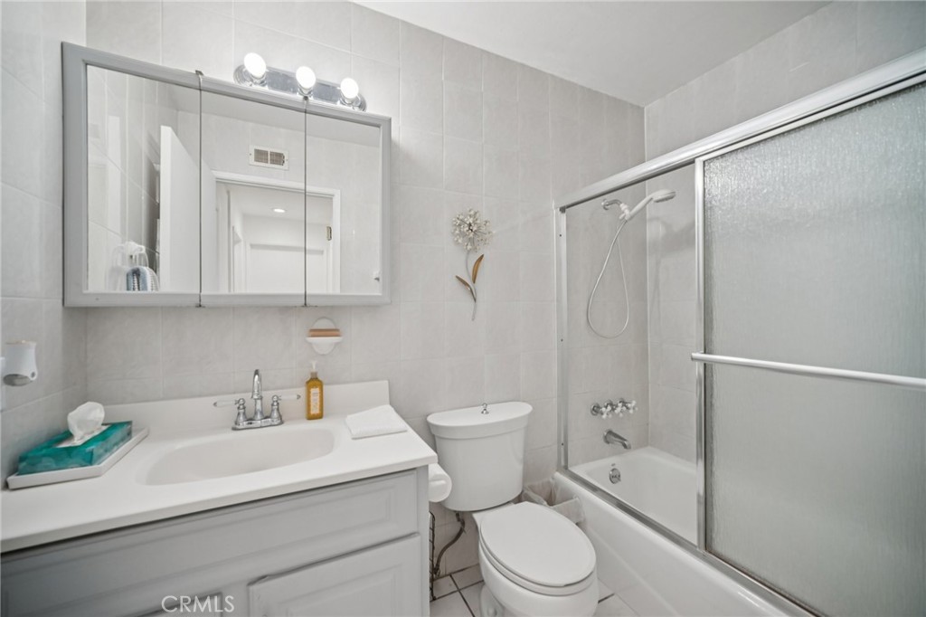 11461 Amigo Avenue Porter Ranch, CA 91326 - Photo 16 of 52 a bathroom with a sink a toilet and shower