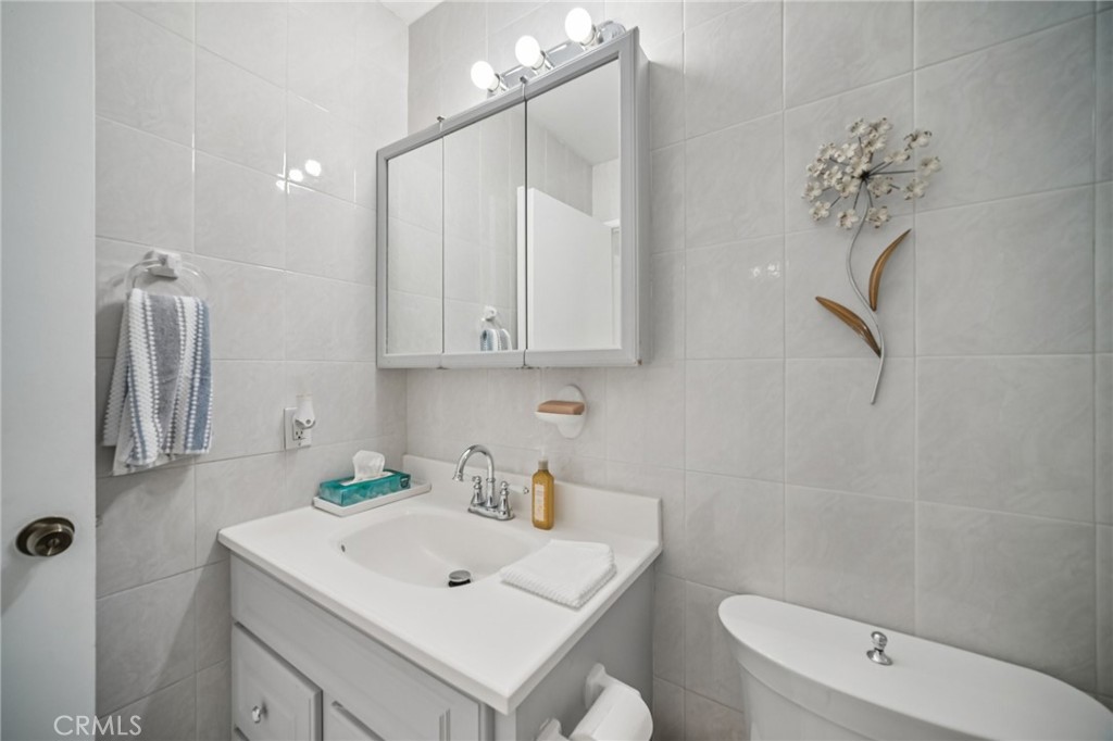 11461 Amigo Avenue Porter Ranch, CA 91326 - Photo 17 of 52 a bathroom with a sink a toilet and shower