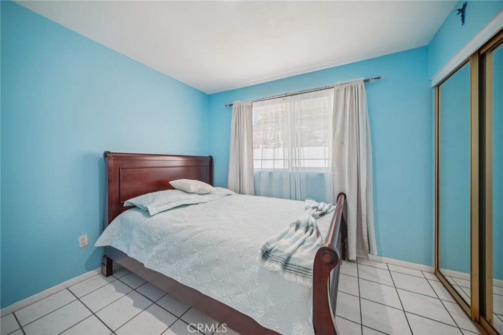 11461 Amigo Avenue Porter Ranch, CA 91326 - Photo 20 of 52 a bedroom with a bed and a window