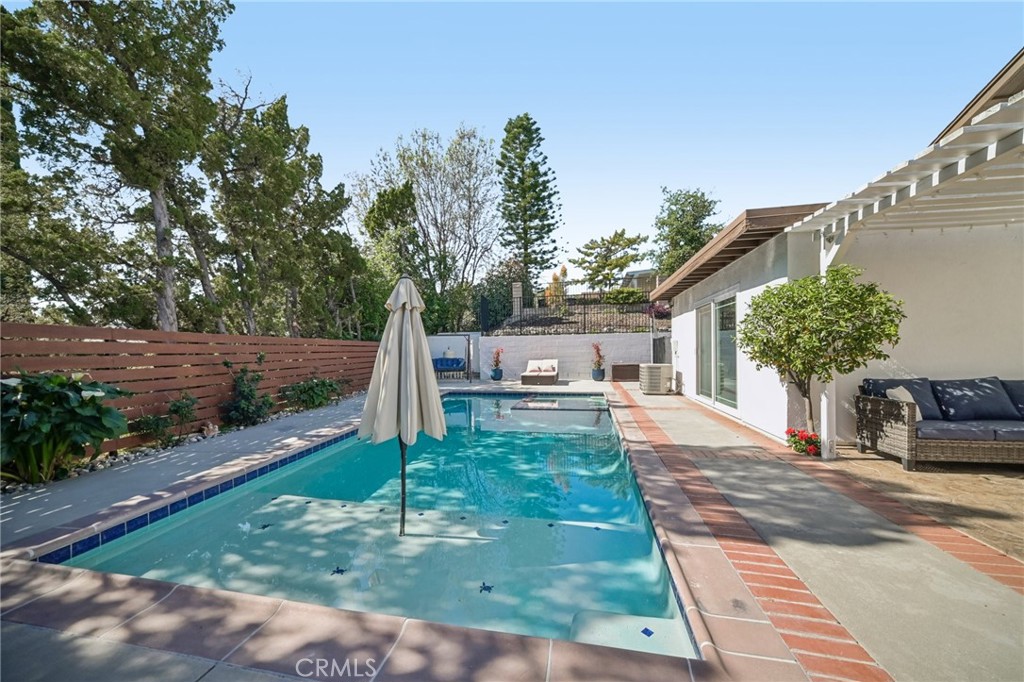 11461 Amigo Avenue Porter Ranch, CA 91326 - Photo 34 of 52 a front view of a house with garden
