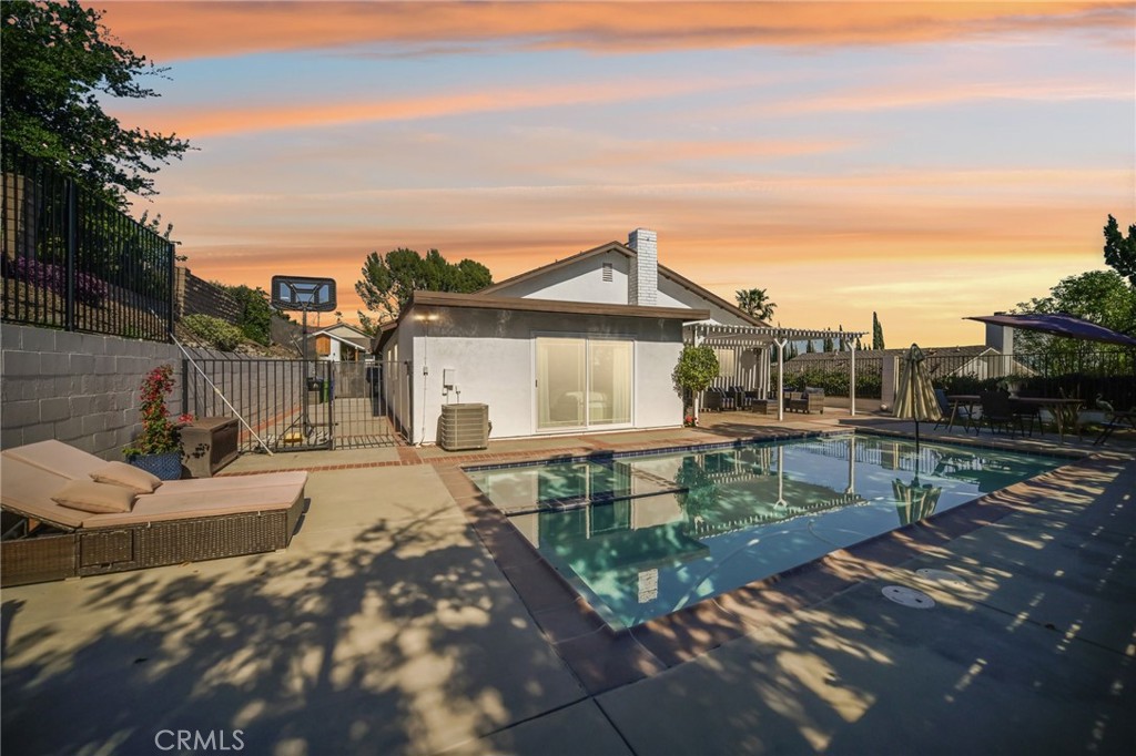 11461 Amigo Avenue Porter Ranch, CA 91326 - Photo 35 of 52 a view of a house with backyard sitting area and garden