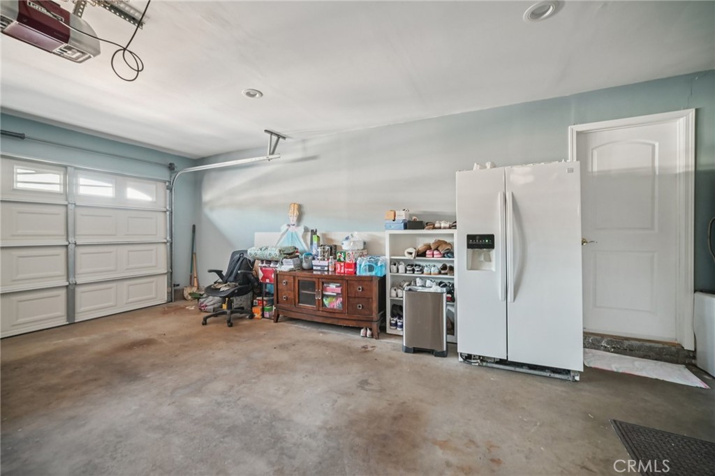 11461 Amigo Avenue Porter Ranch, CA 91326 - Photo 38 of 52 a view of a storage & utility room with closet washing machine and a ceiling fan