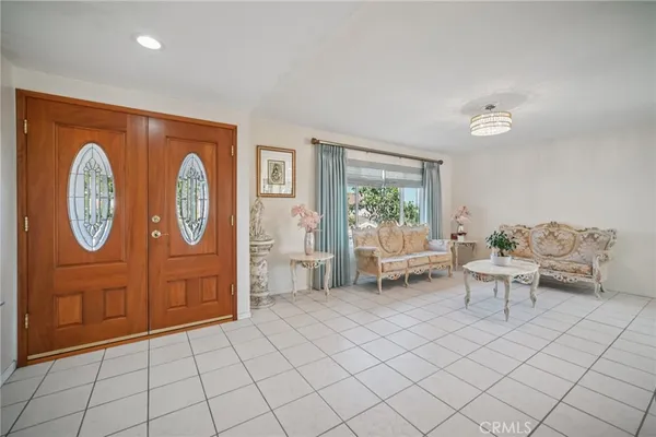 a living room with furniture and a table
