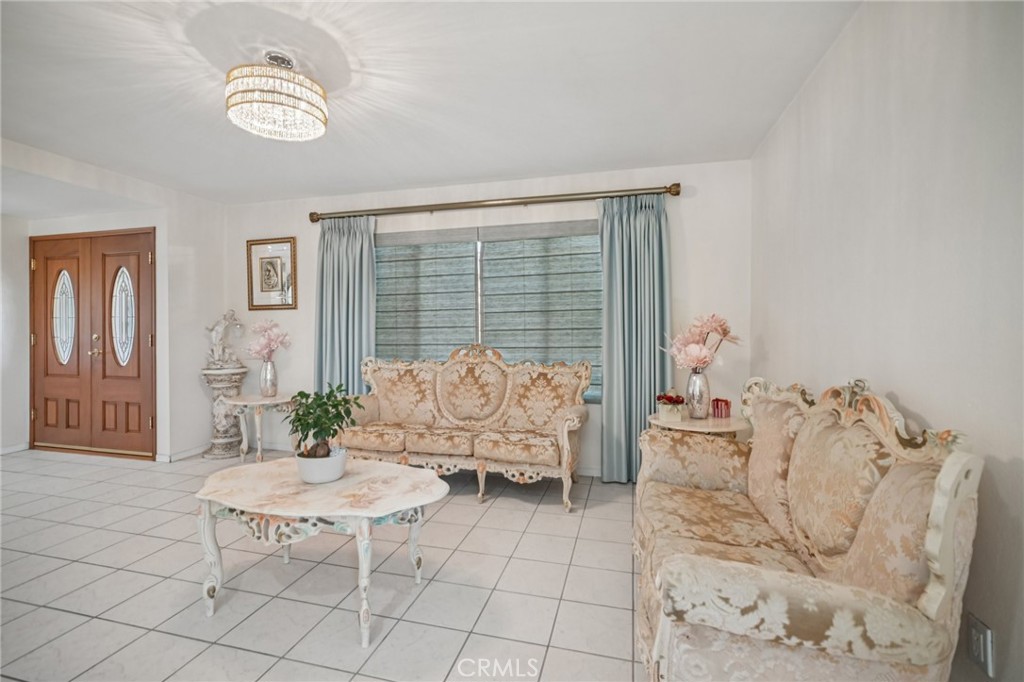 11461 Amigo Avenue Porter Ranch, CA 91326 - Photo 5 of 52 a living room with furniture and a table