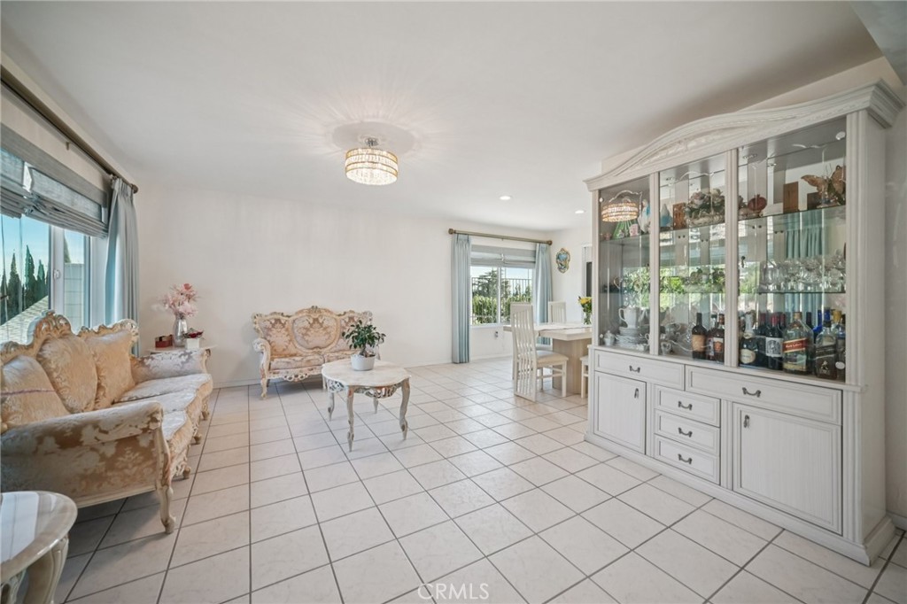 11461 Amigo Avenue Porter Ranch, CA 91326 - Photo 6 of 52 a living room with furniture and a large window