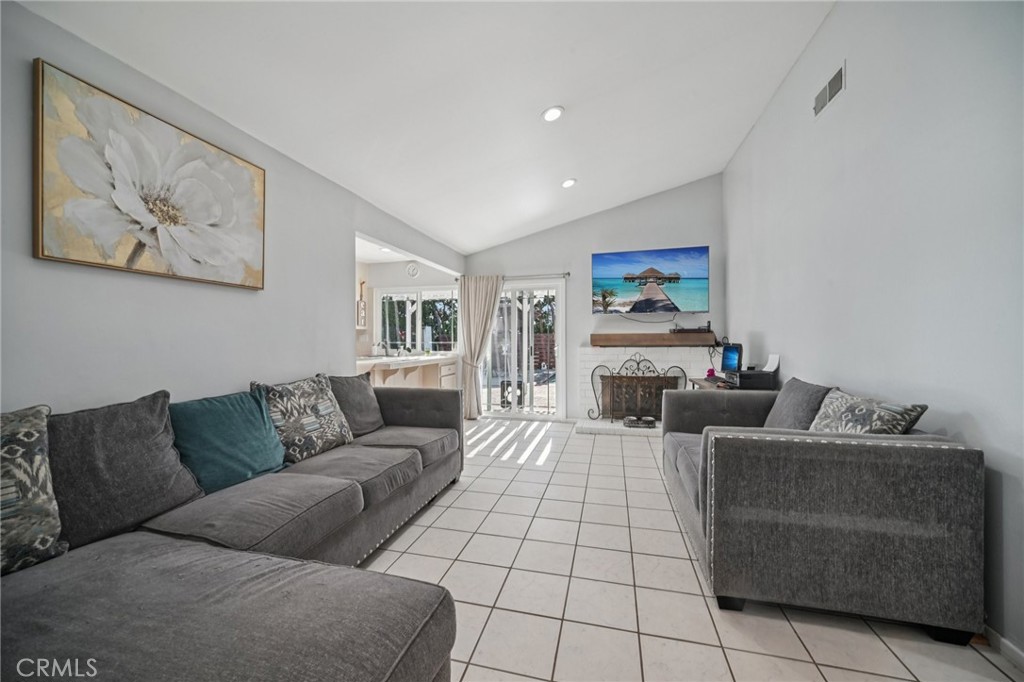 11461 Amigo Avenue Porter Ranch, CA 91326 - Photo 8 of 52 a living room with furniture and a couch