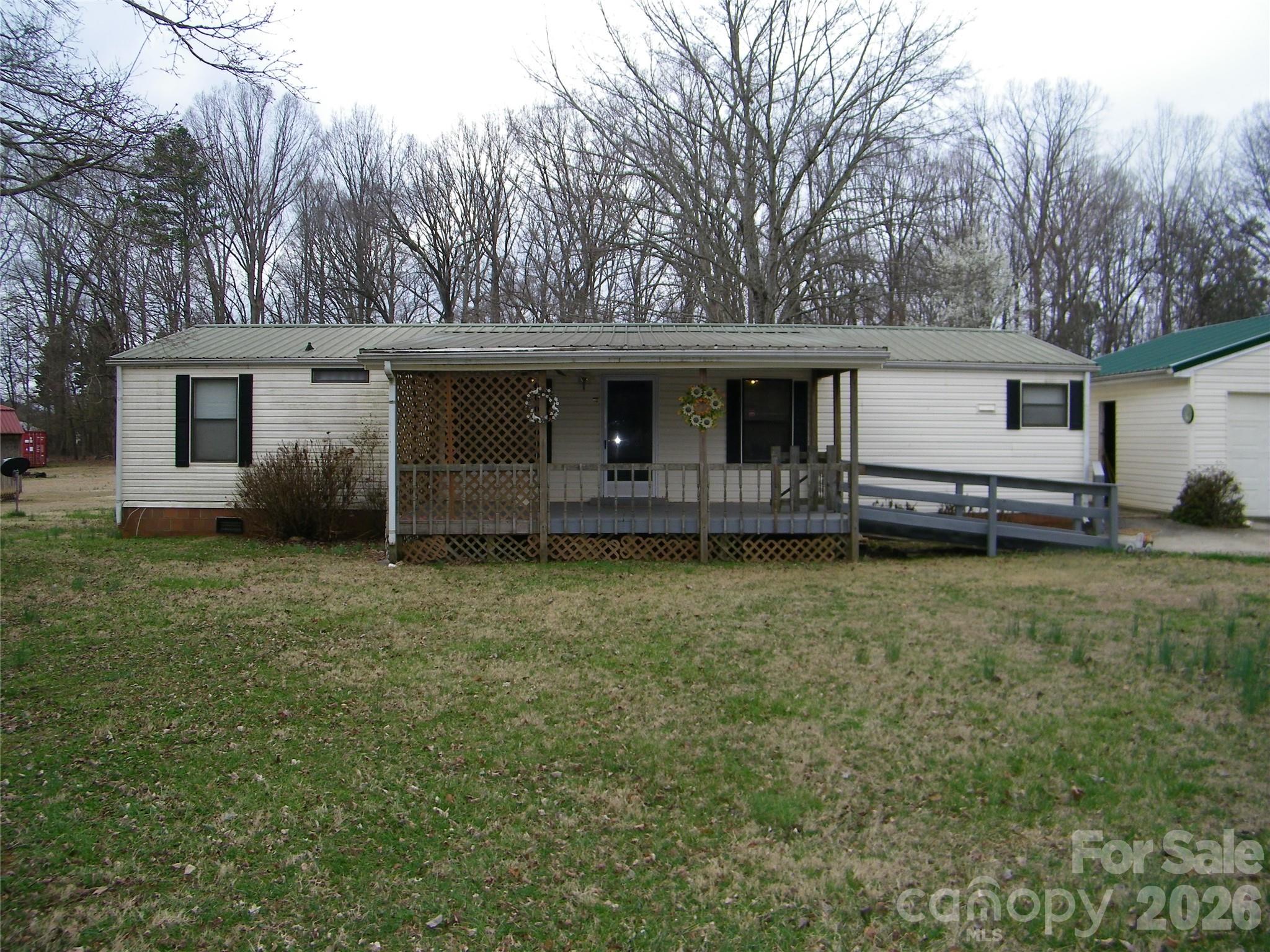 355 Ranchwood Drive Salisbury, NC 28146 - Photo 2 of 18 a view of a house with backyard and garden