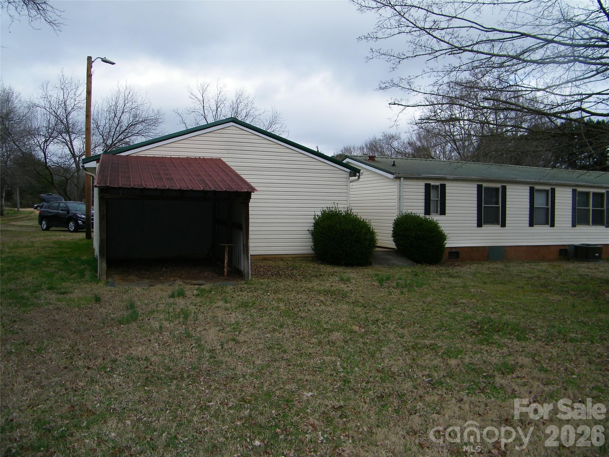 355 Ranchwood Drive Salisbury, NC 28146 - Photo 3 of 18 a backyard of a house with table and chairs