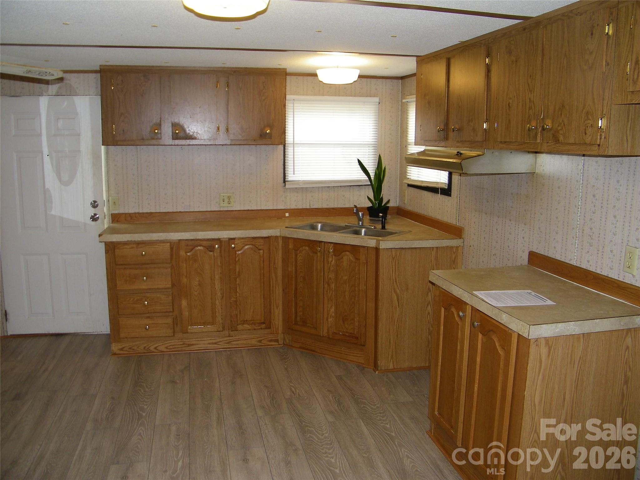 355 Ranchwood Drive Salisbury, NC 28146 - Photo 6 of 18 a kitchen with a sink and cabinets