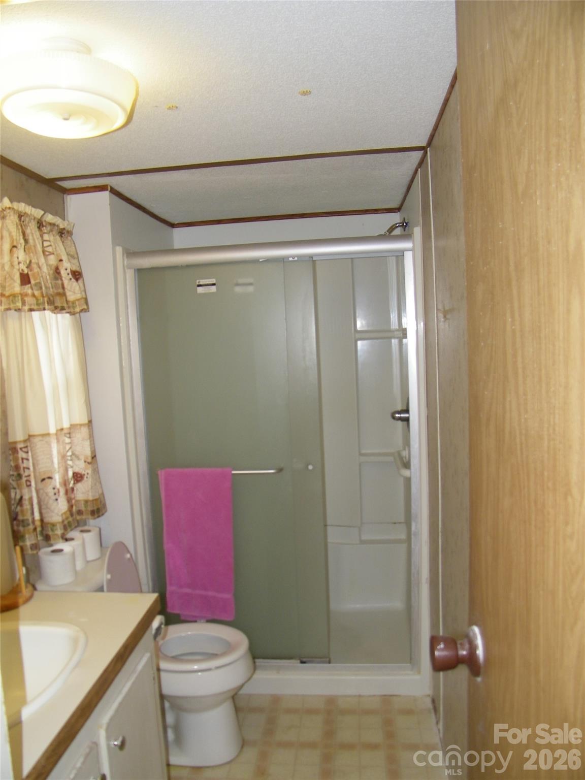 355 Ranchwood Drive Salisbury, NC 28146 - Photo 9 of 18 a bathroom with a granite countertop toilet sink and shower
