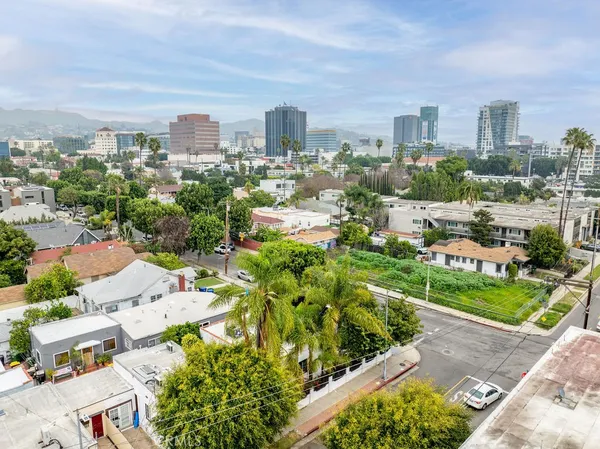 an aerial view of a house with a yard and garden