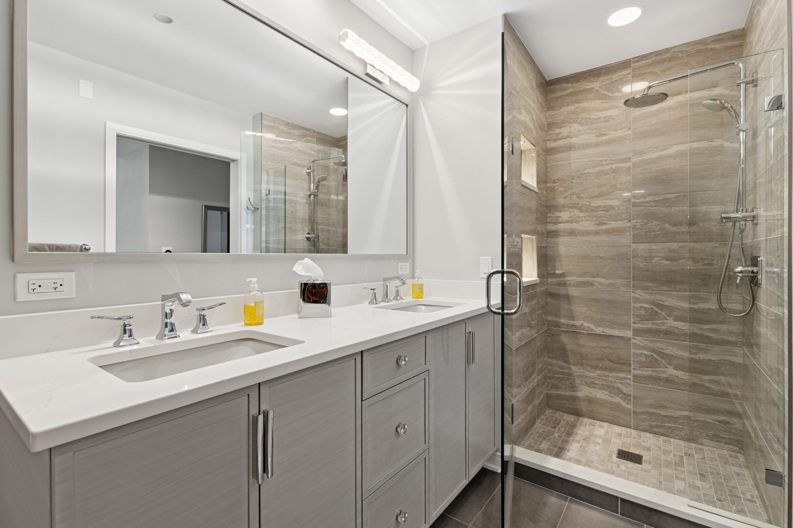 60 East Monroe Street, Unit 3402 Chicago, IL 60603 - Photo 15 of 31 a bathroom with a shower sink and mirror