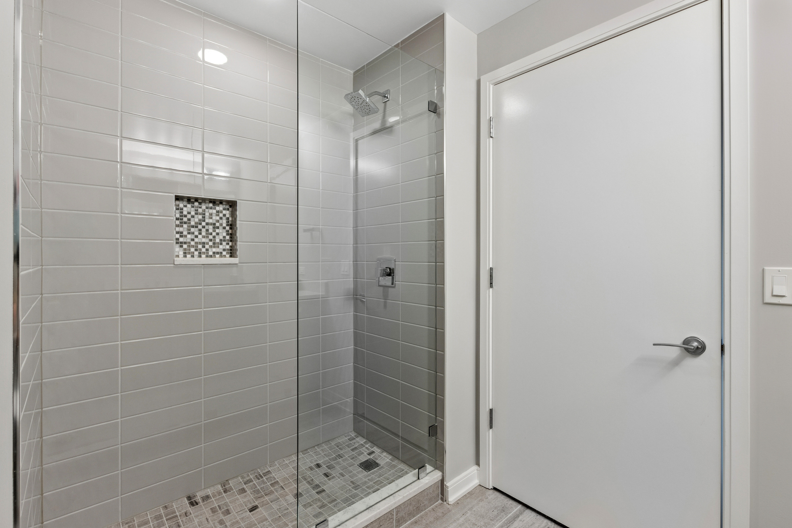 60 East Monroe Street, Unit 3402 Chicago, IL 60603 - Photo 20 of 31 a bathroom with a shower and a sink