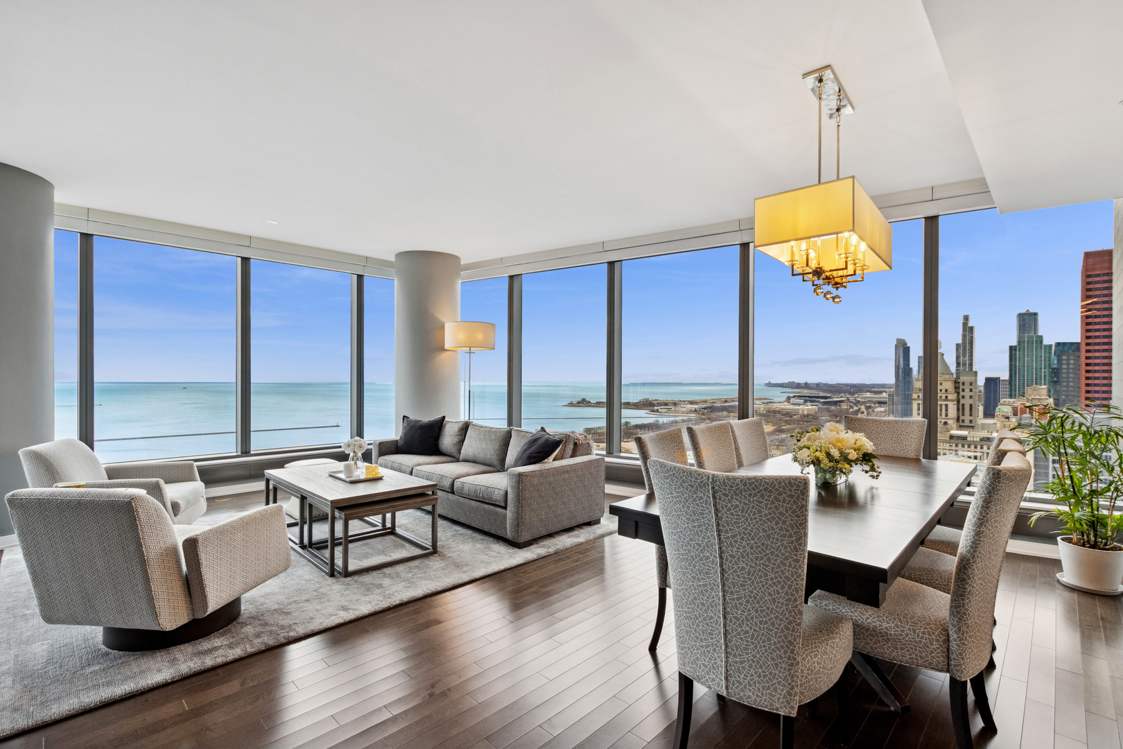 60 East Monroe Street, Unit 3402 Chicago, IL 60603 - Photo 2 of 31 a living room with fireplace furniture and a large window