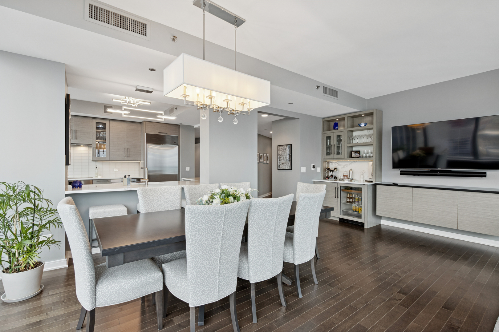 60 East Monroe Street, Unit 3402 Chicago, IL 60603 - Photo 7 of 31 a view of a dining room with furniture and wooden floor